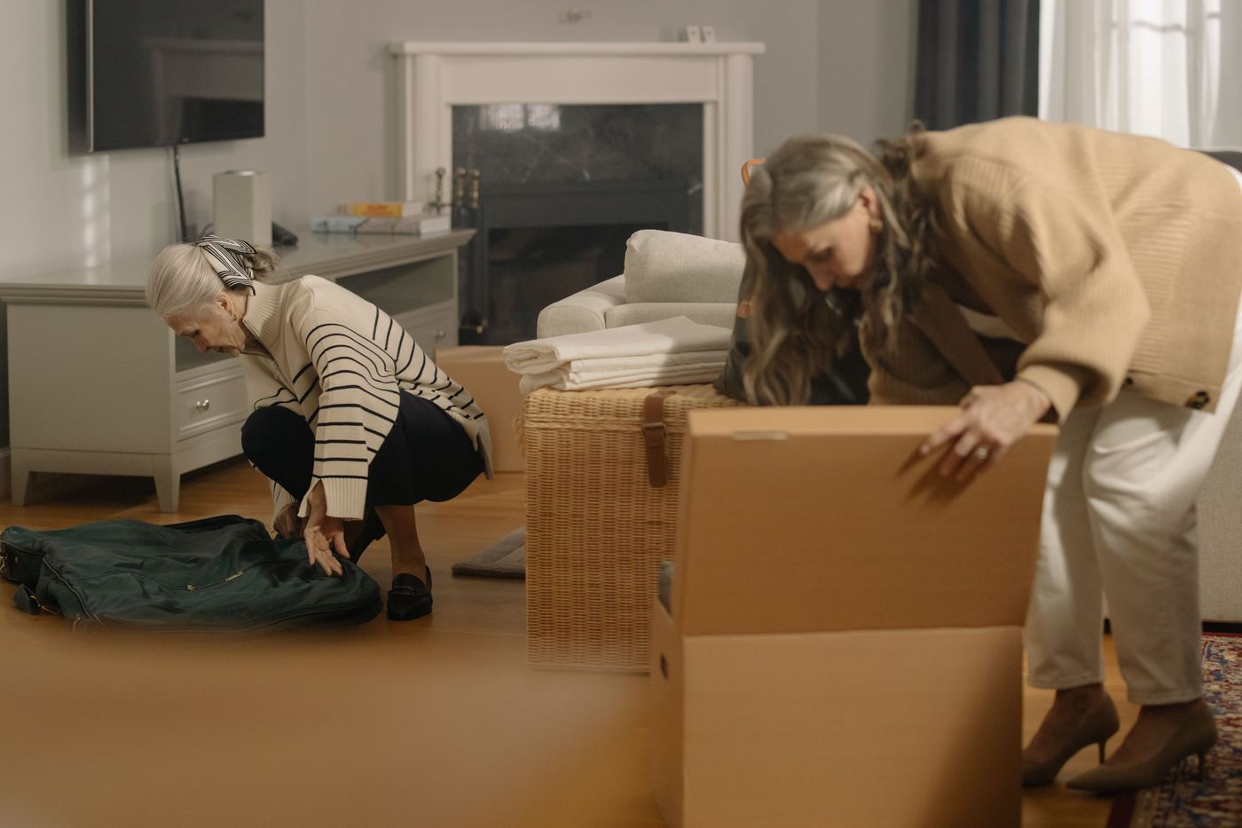 Two women packing and organizing belongings while downsizing a home in Canyon Country, Santa Clarita